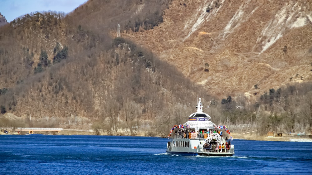 a large boat with a lot of people on it in the water