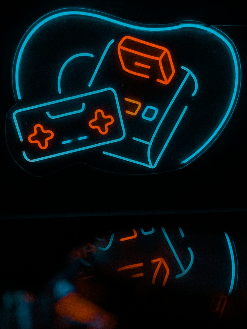 a neon sign with a video game controller