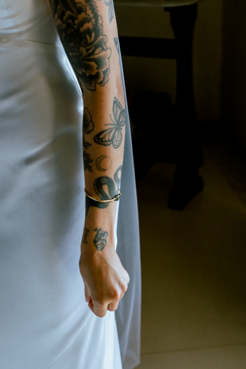 a woman with a tattoo on her arm