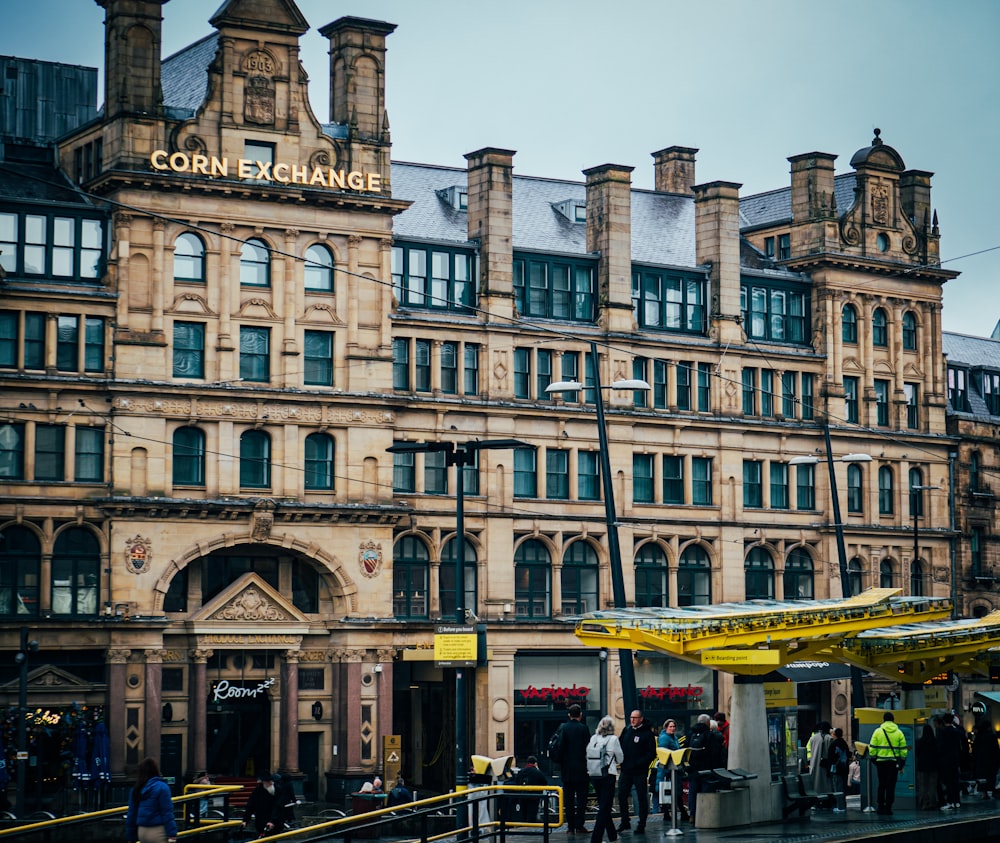 a group of people standing outside of a building