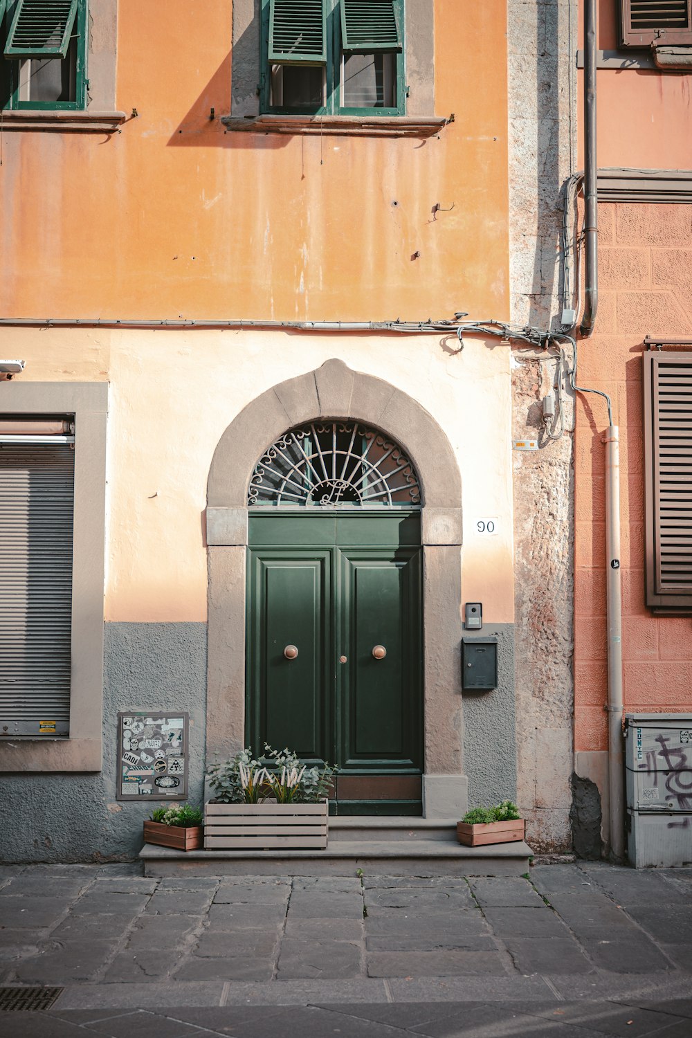 a building with a green door and window