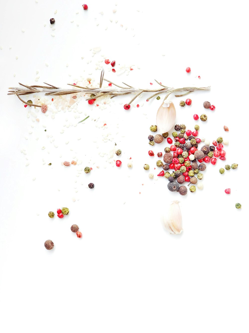 a white table topped with lots of different types of spices