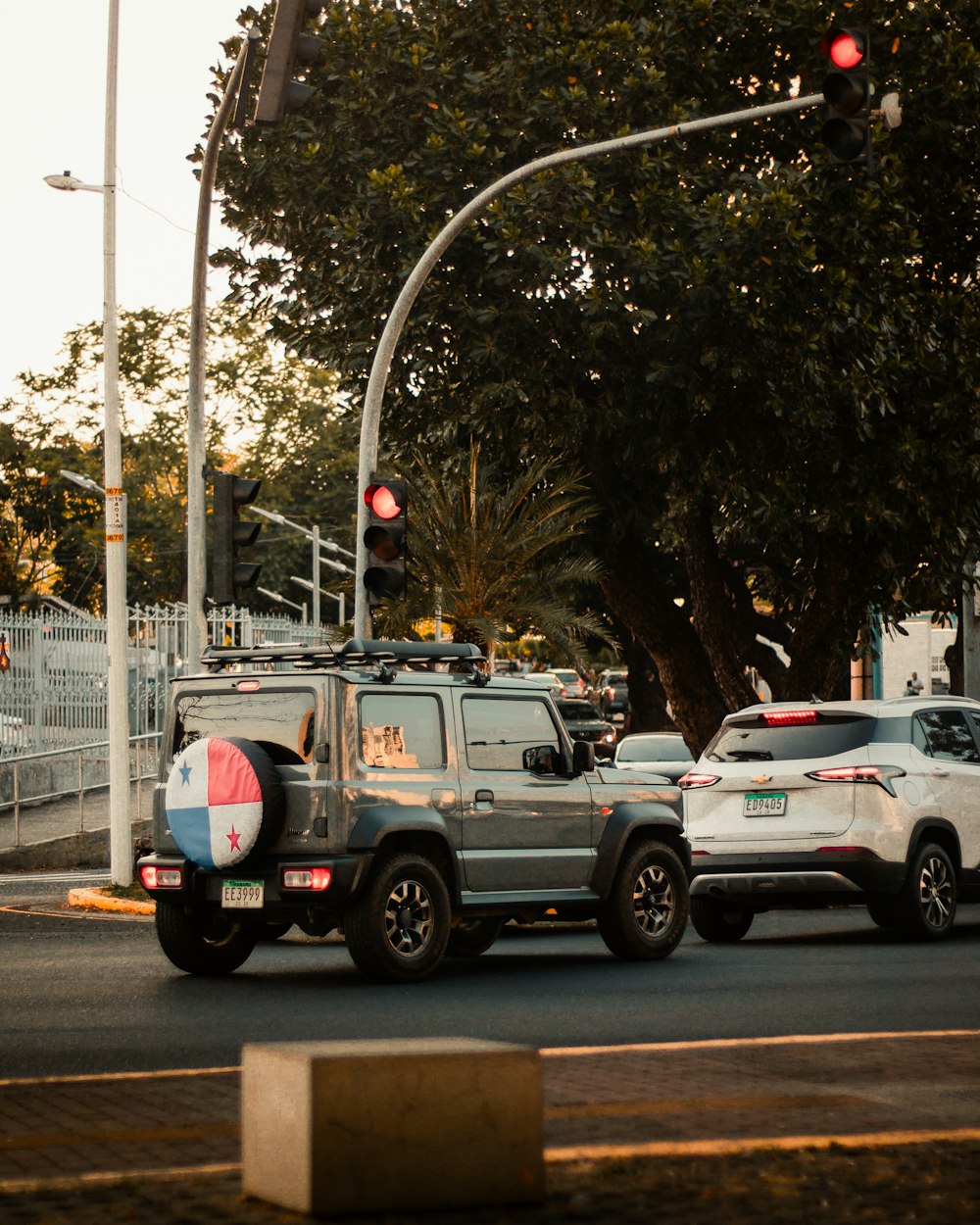 a couple of cars that are sitting in the street