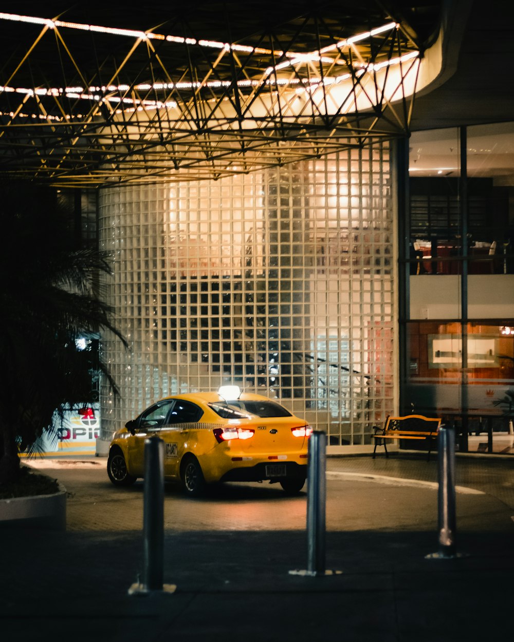 a yellow car parked in front of a building