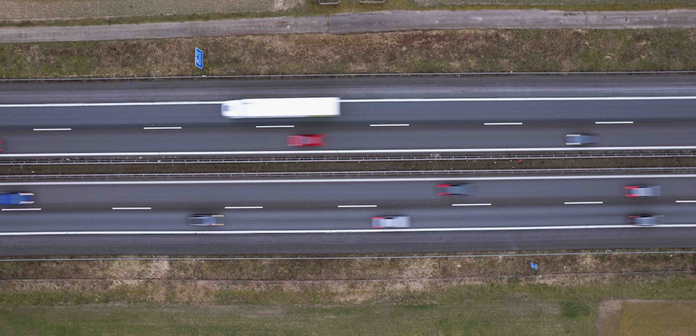 an aerial view of a highway with cars driving on it