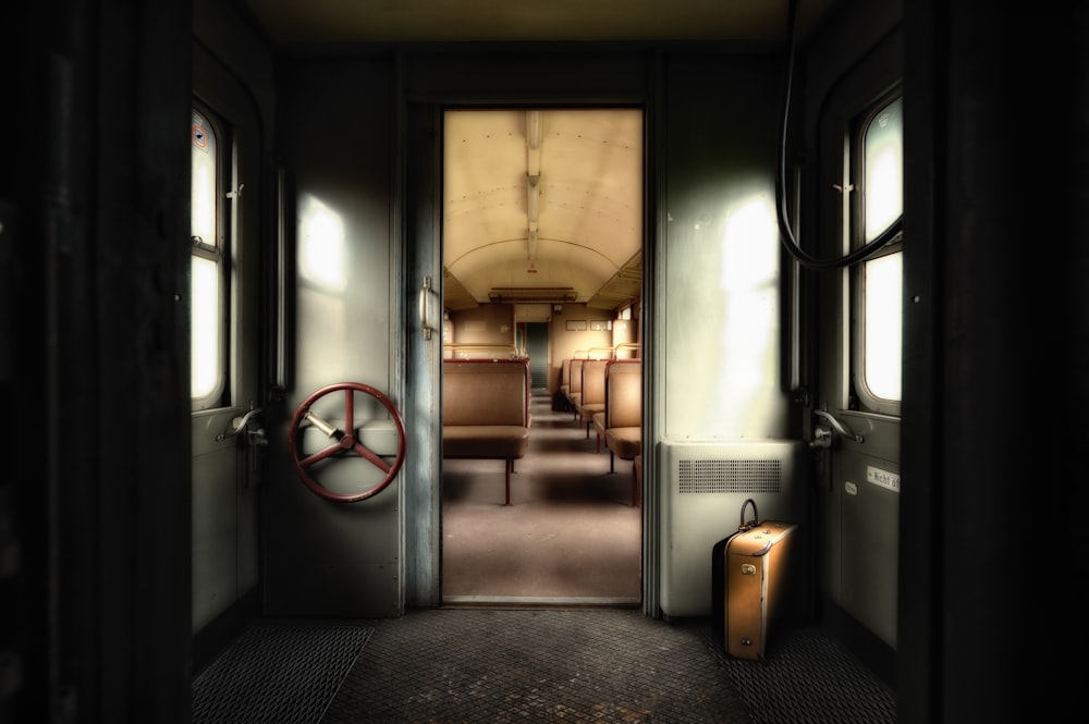 an empty train car with a door open