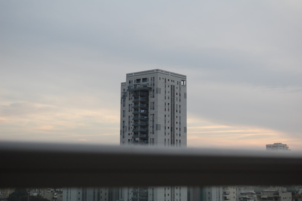 a tall building with a sky background