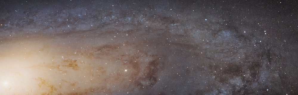 a large spiral galaxy with stars in the background