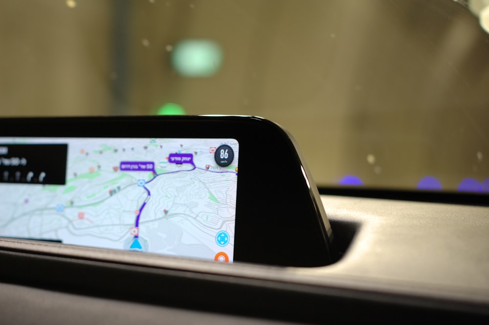 a car dashboard with a gps app on it