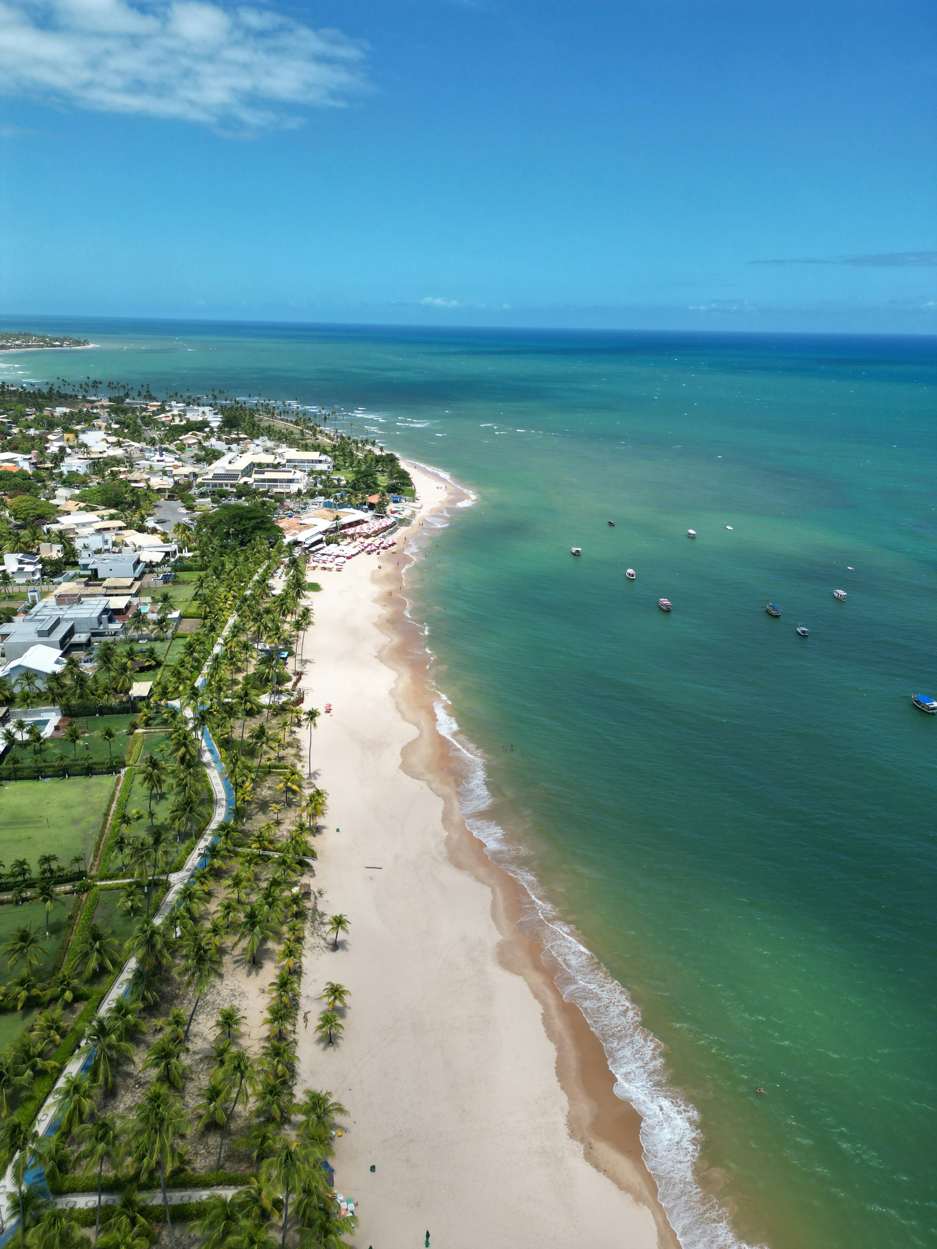 Boats off Guarajuba beach from above