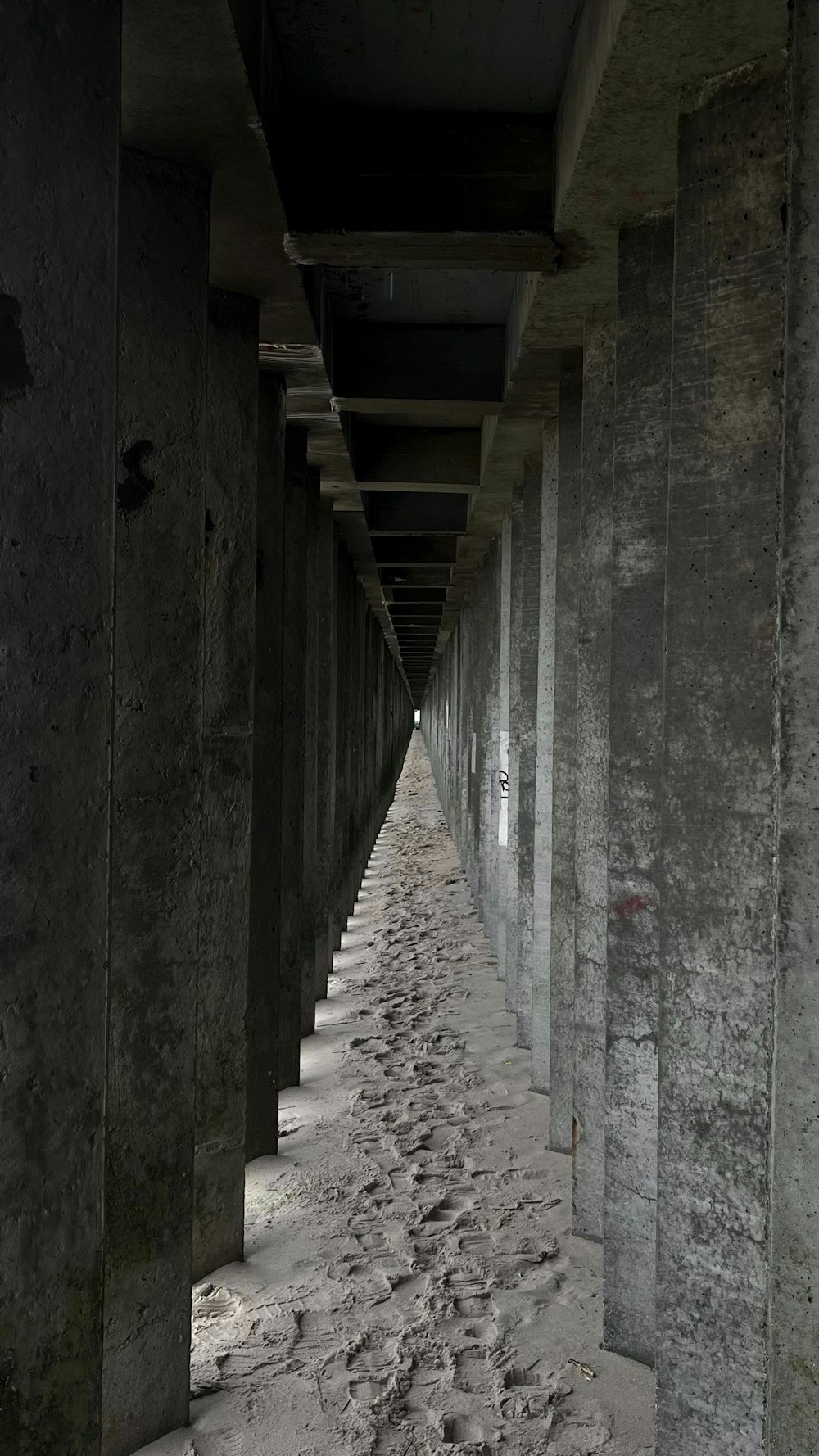 a row of concrete pillars next to each other