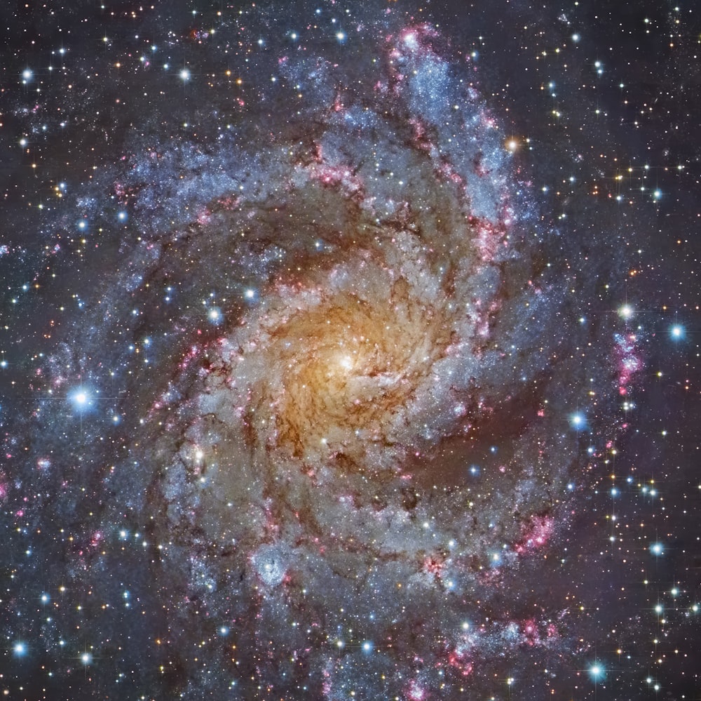 a spiral galaxy with stars in the background