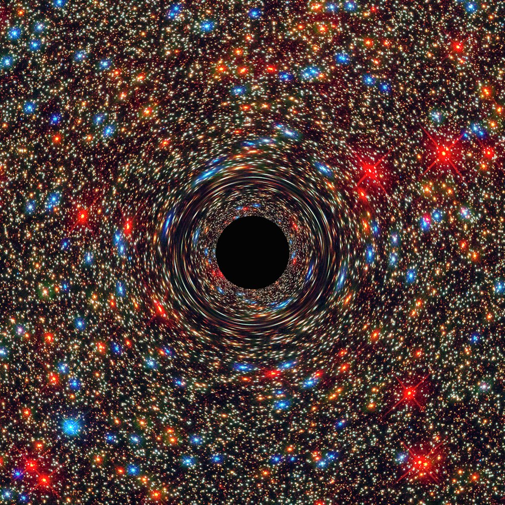 a black hole in the center of a space filled with stars