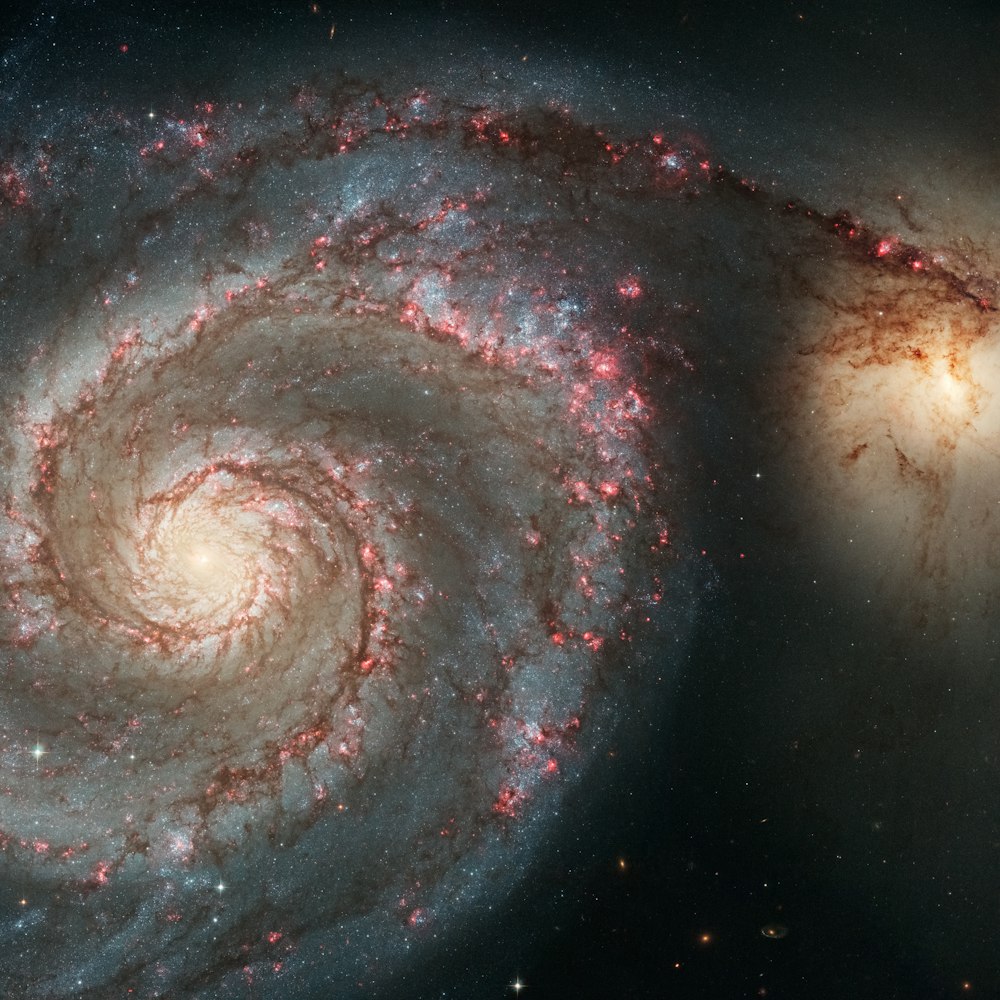 two very large spiral shaped objects in the sky