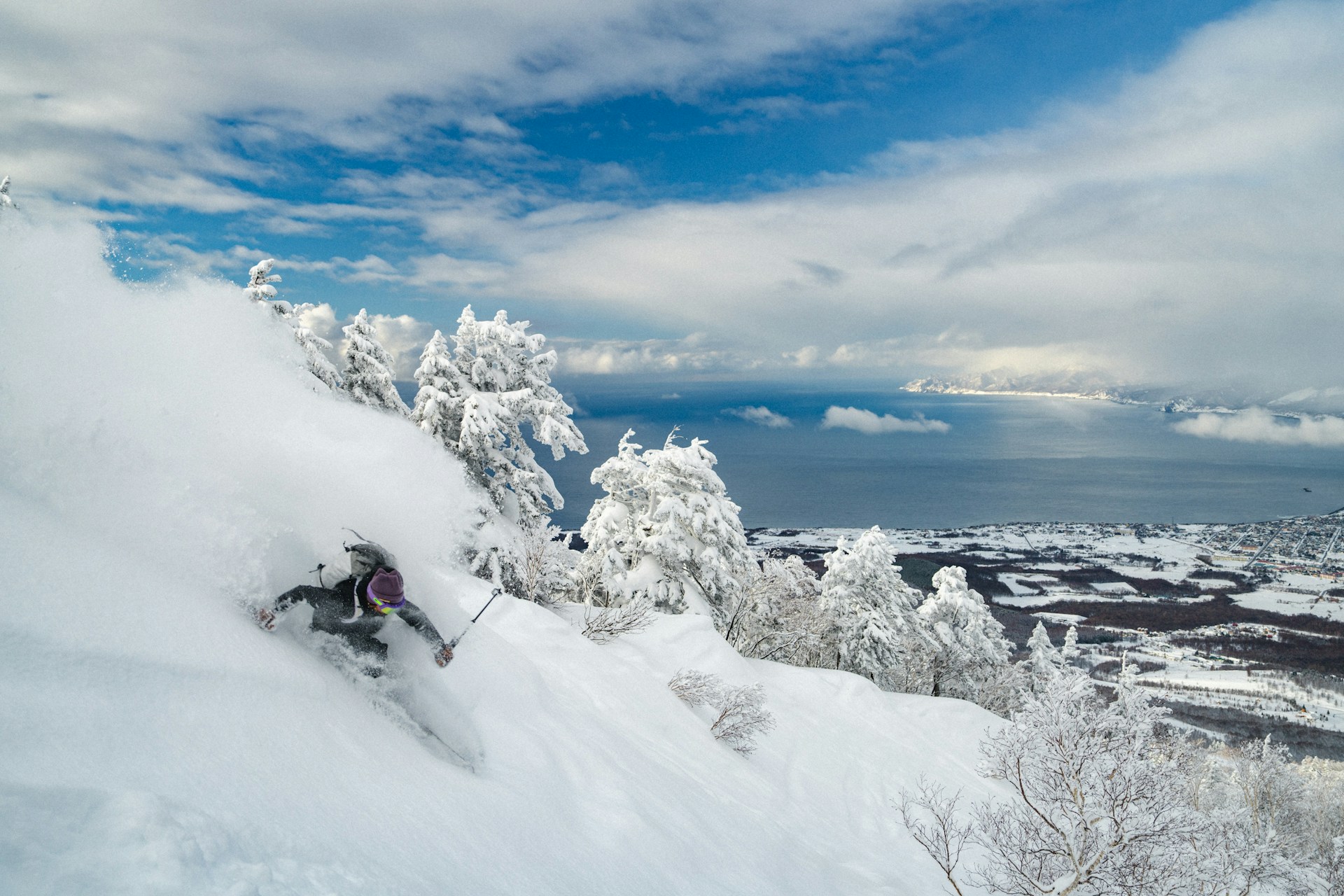 a person skiing down a snow covered mountain