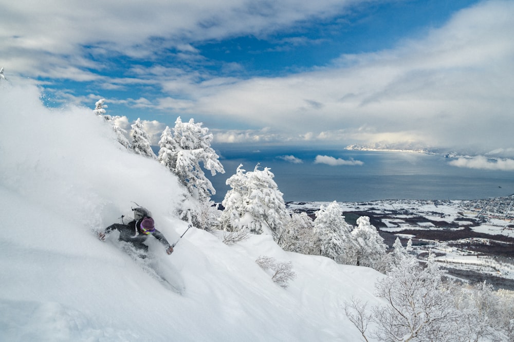 a person skiing down a snow covered mountain