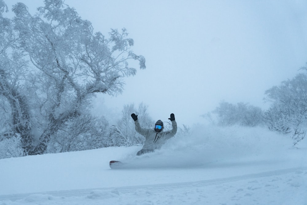 a person on a snowboard in the snow