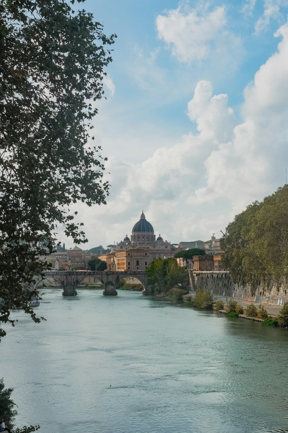 a river running through a city next to a bridge