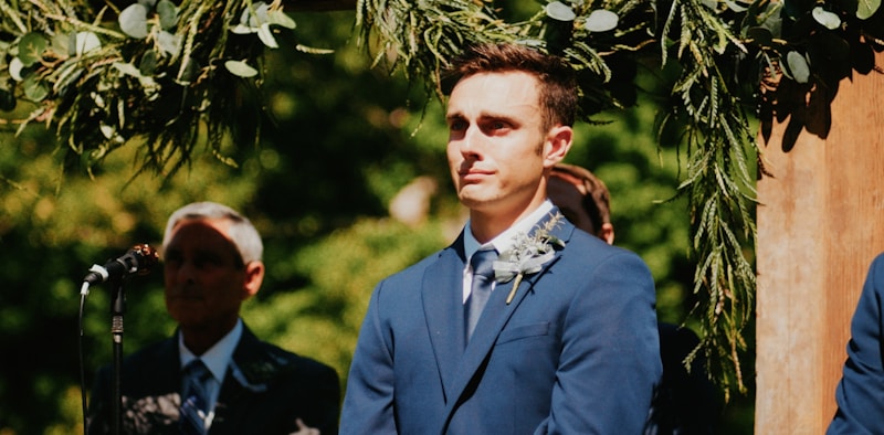 Man in blue suit on stage