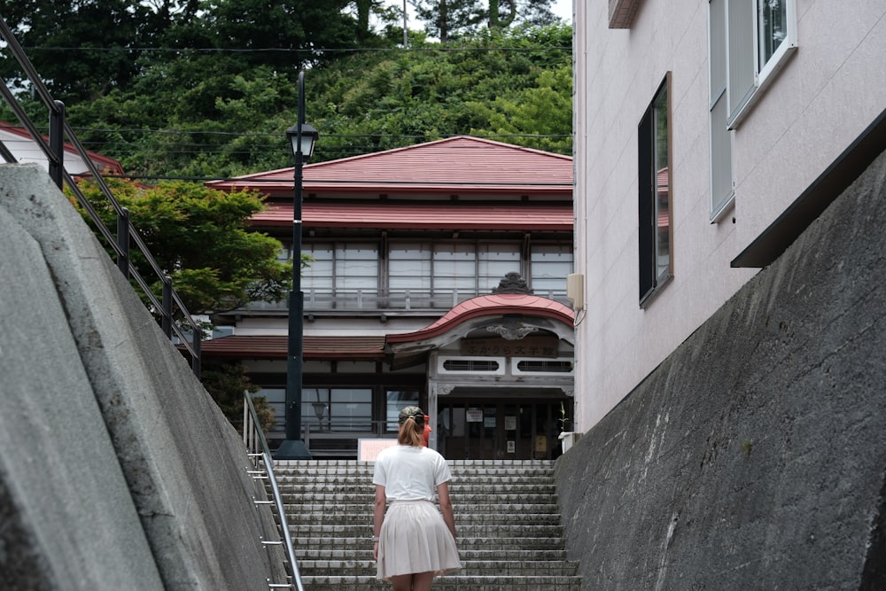 a woman walking down a flight of stairs