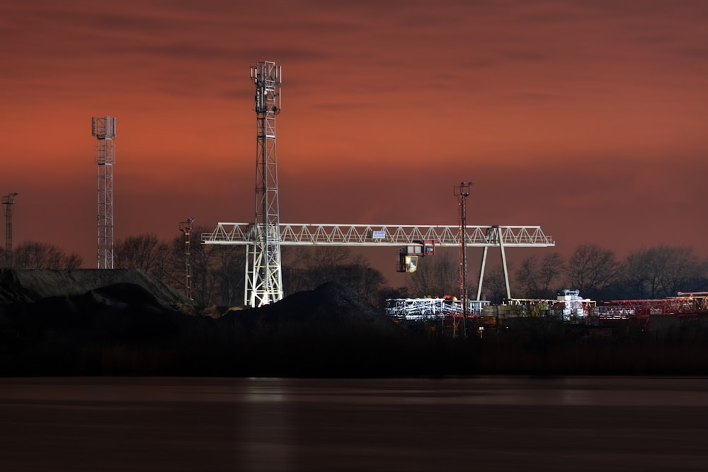 a large crane sitting on top of a body of water