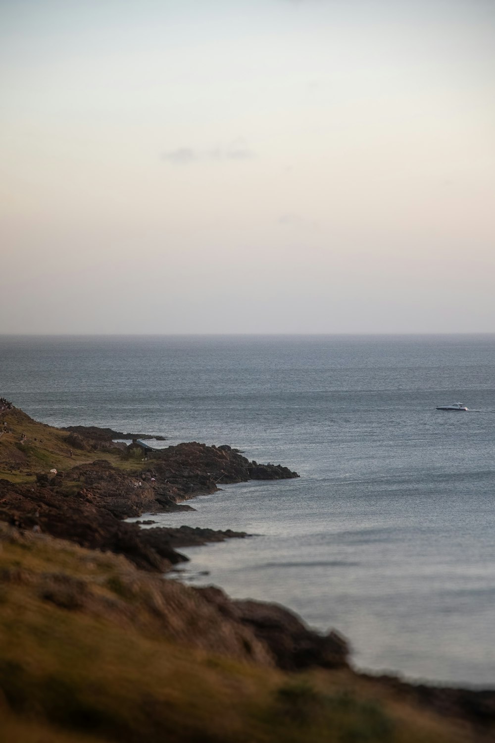 a lone boat is out on the ocean