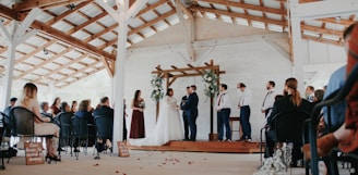 a group of people standing around a wooden structure