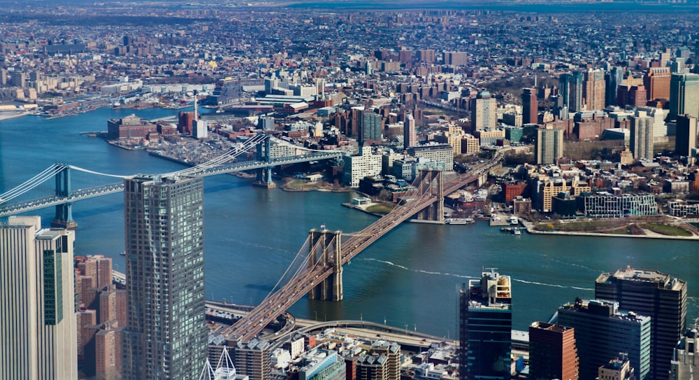 an aerial view of a city and a bridge