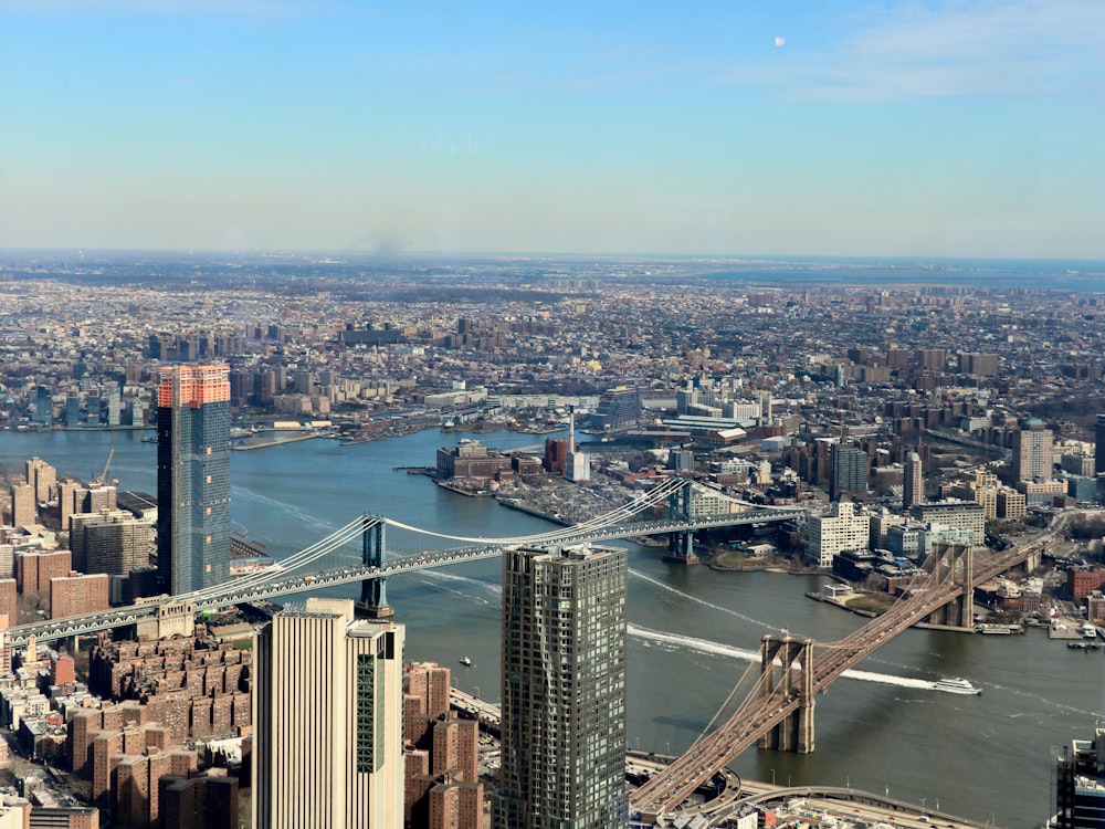 an aerial view of a city and a bridge