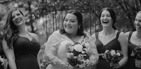 a group of women standing next to each other