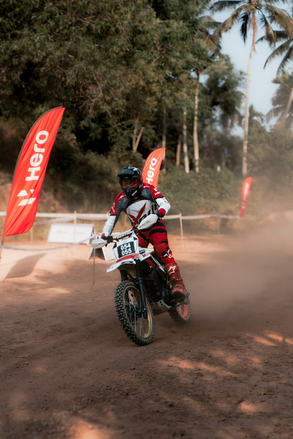 a person riding a dirt bike on a dirt track