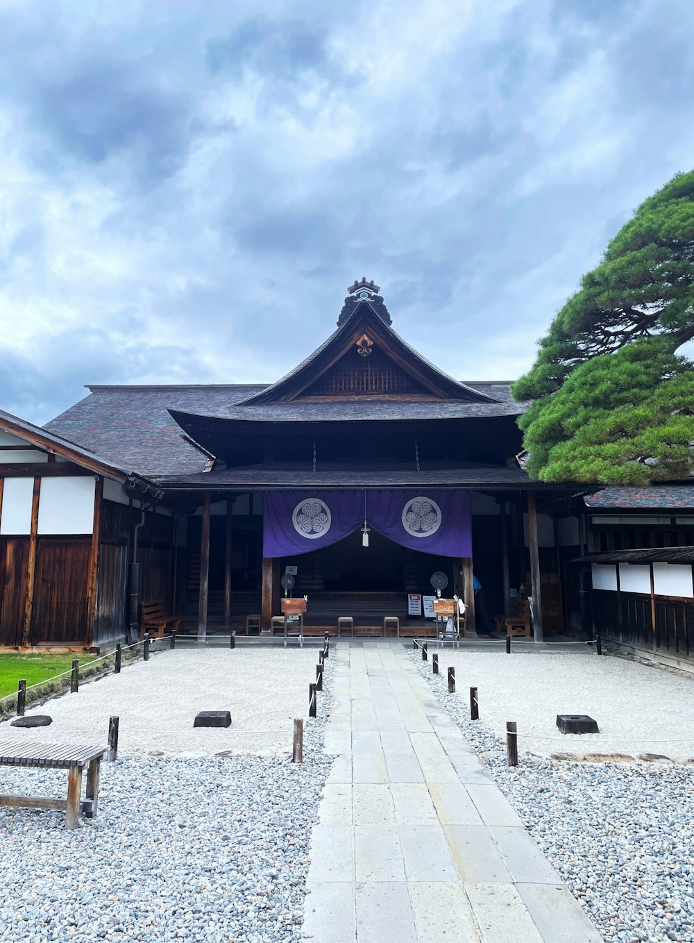 a large building with a long walkway in front of it