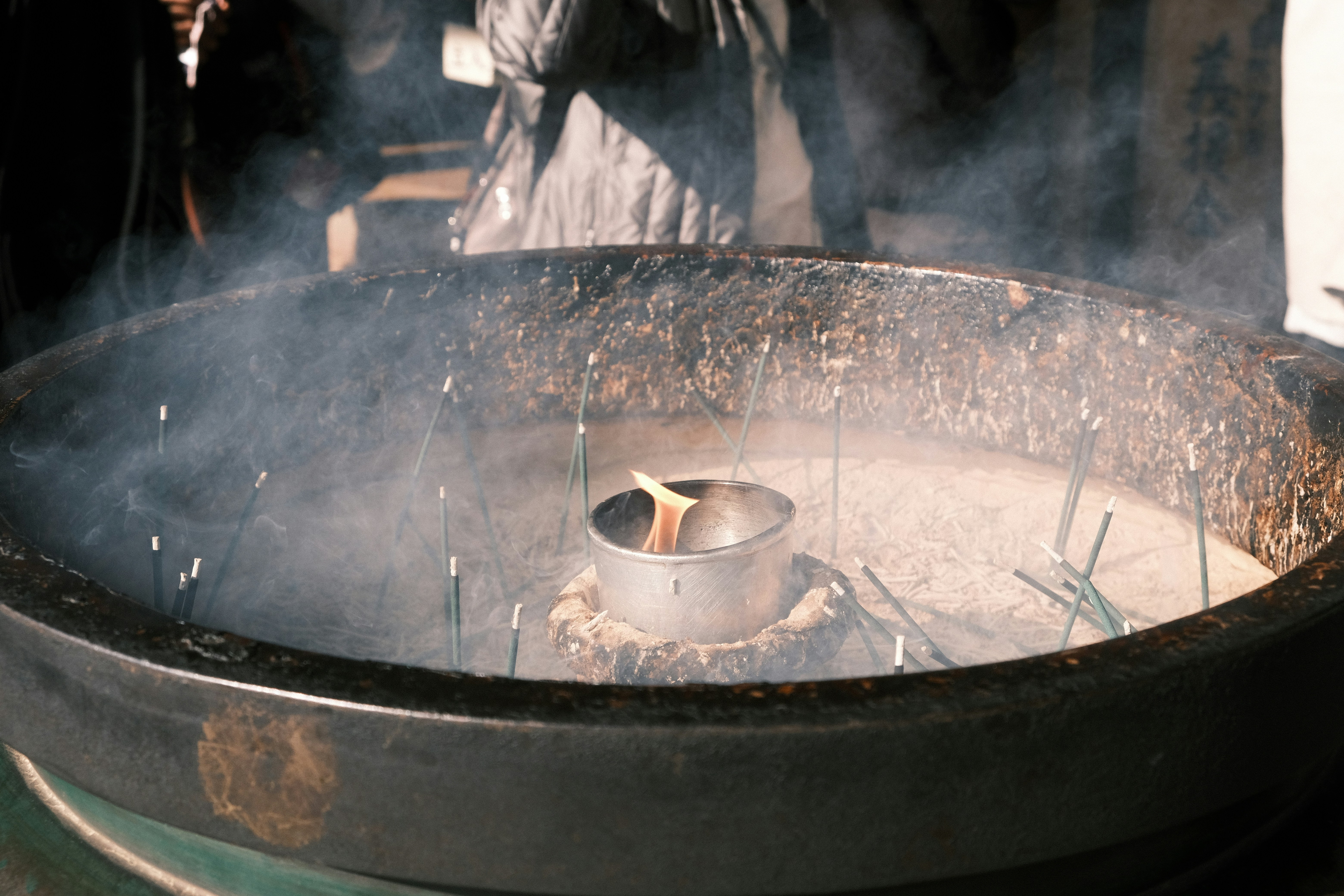 Simmering pot with spices and steam rising, showing warm beverage preparation - cinnamon stick alternative