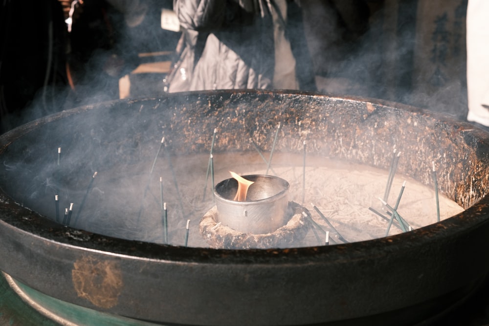 a pot is cooking on a stove with steam coming out of it