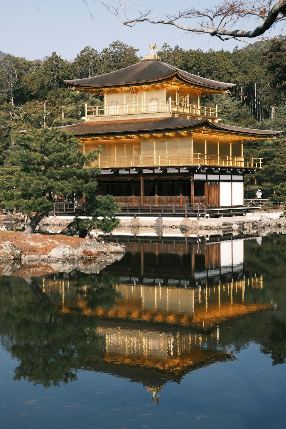 a tall building sitting on top of a lake