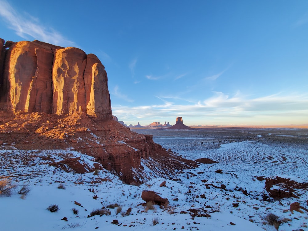 a large rock formation in the middle of a desert