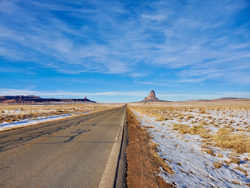 an empty road in the middle of nowhere