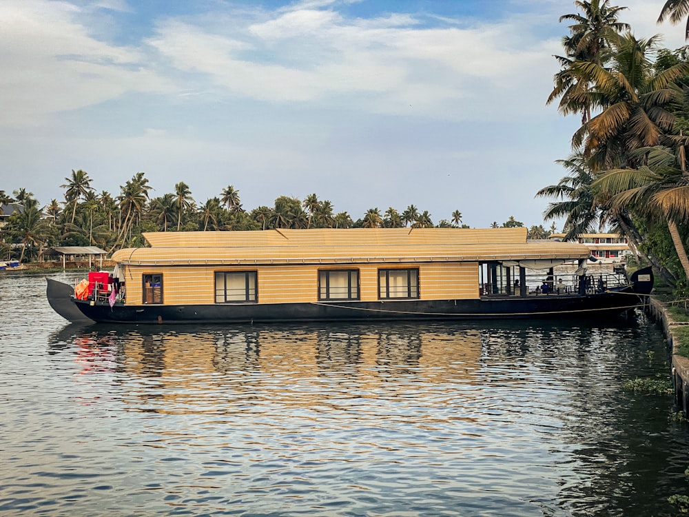 a house boat with a house on the back of it