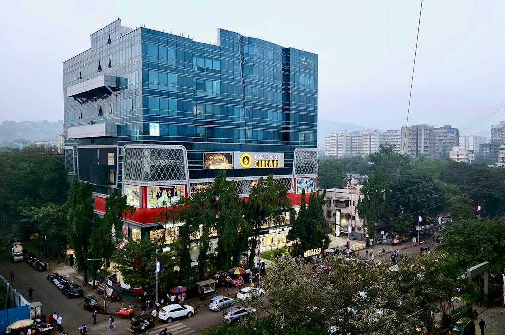 a large building with a lot of cars parked in front of it