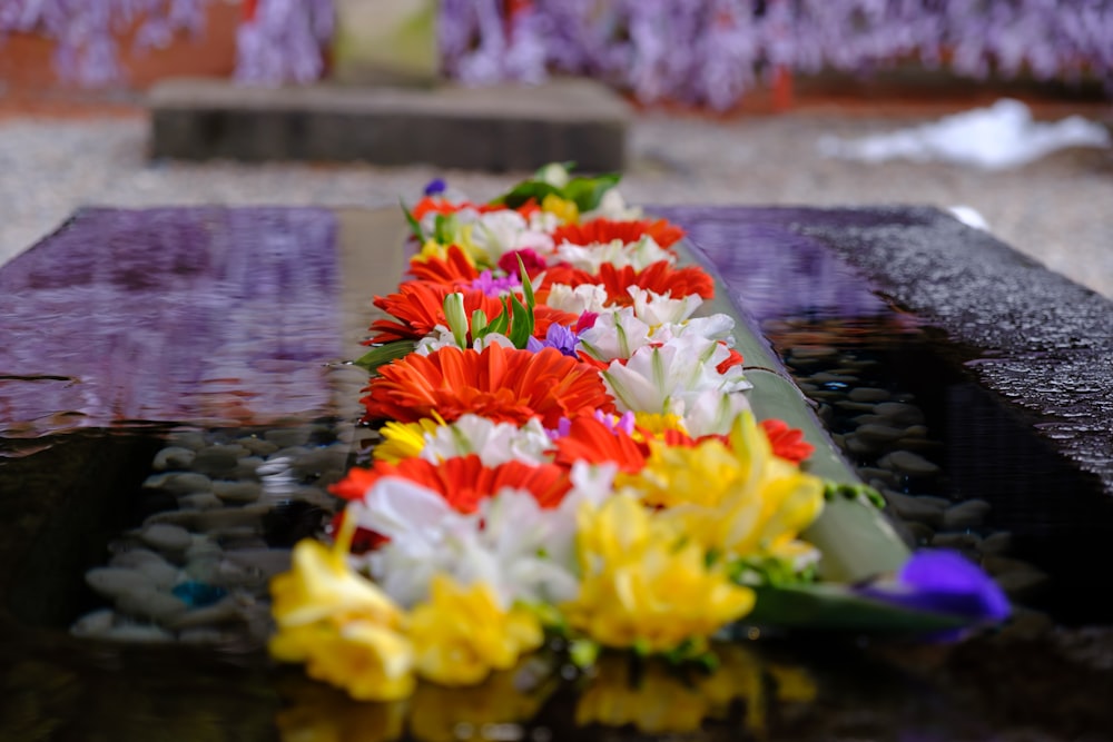 a bunch of flowers that are laying on a table