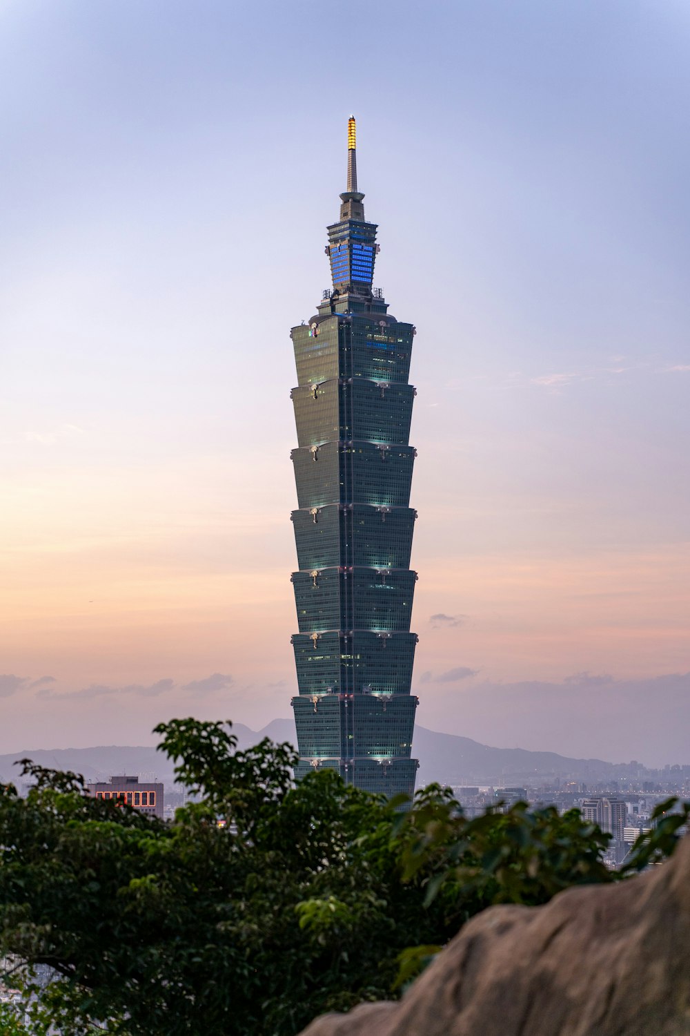 a very tall building towering over a city