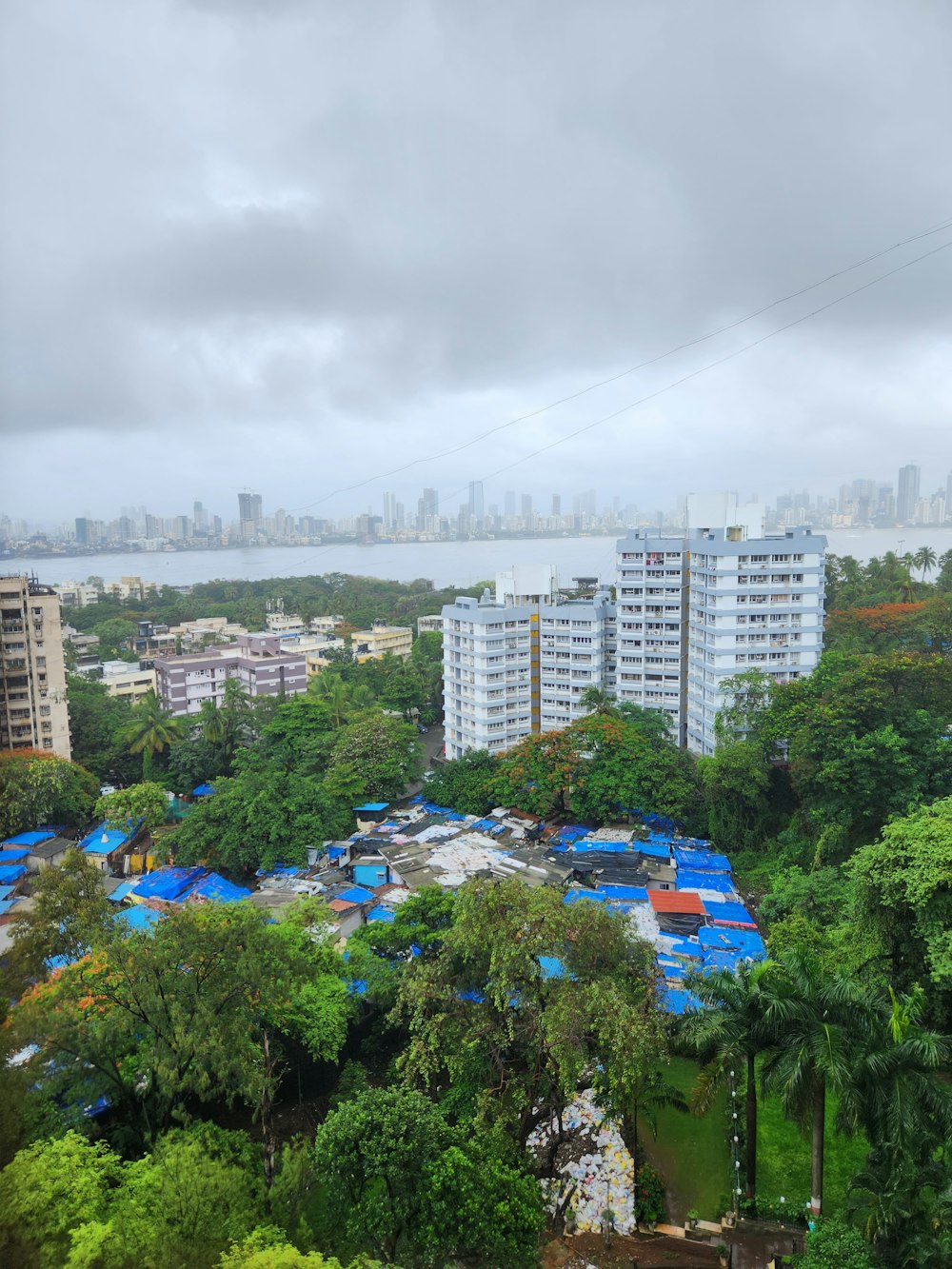 a view of a city with lots of trees and buildings