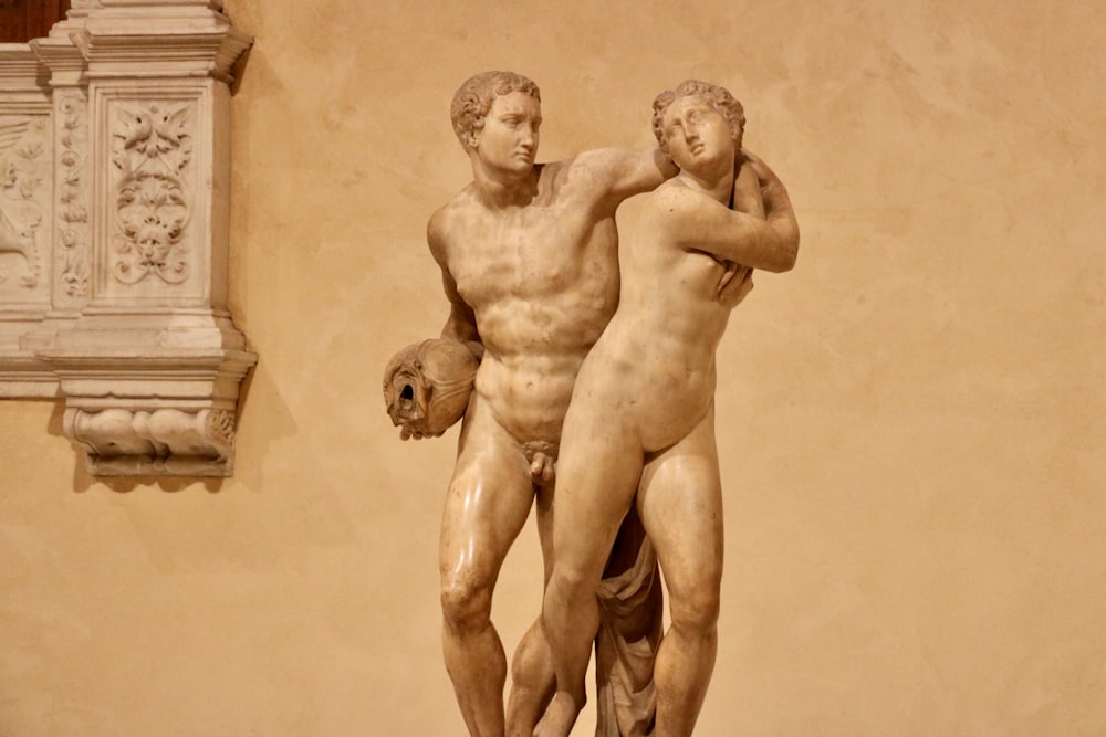 a statue of two men standing next to each other