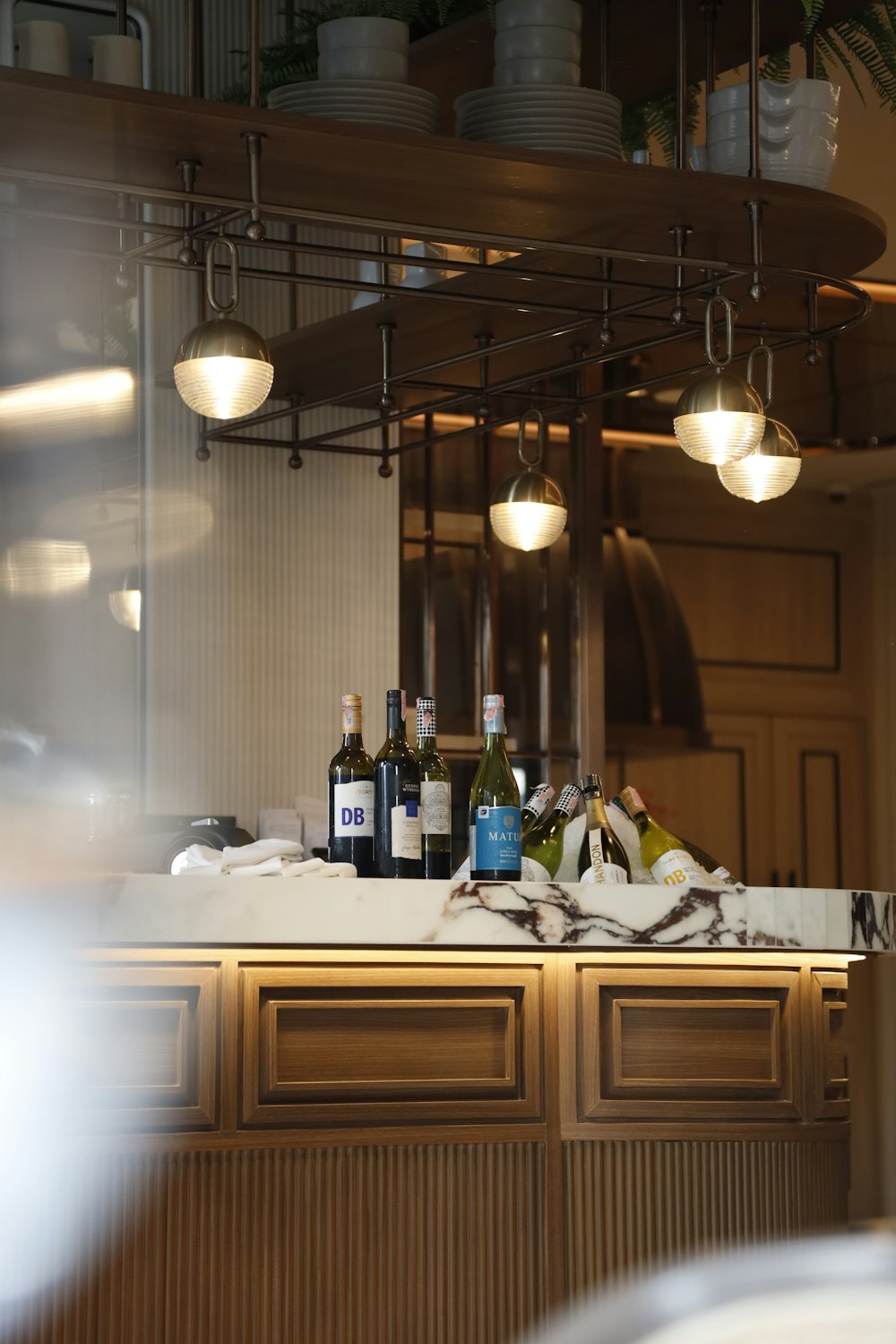 bottles of wine are sitting on a counter