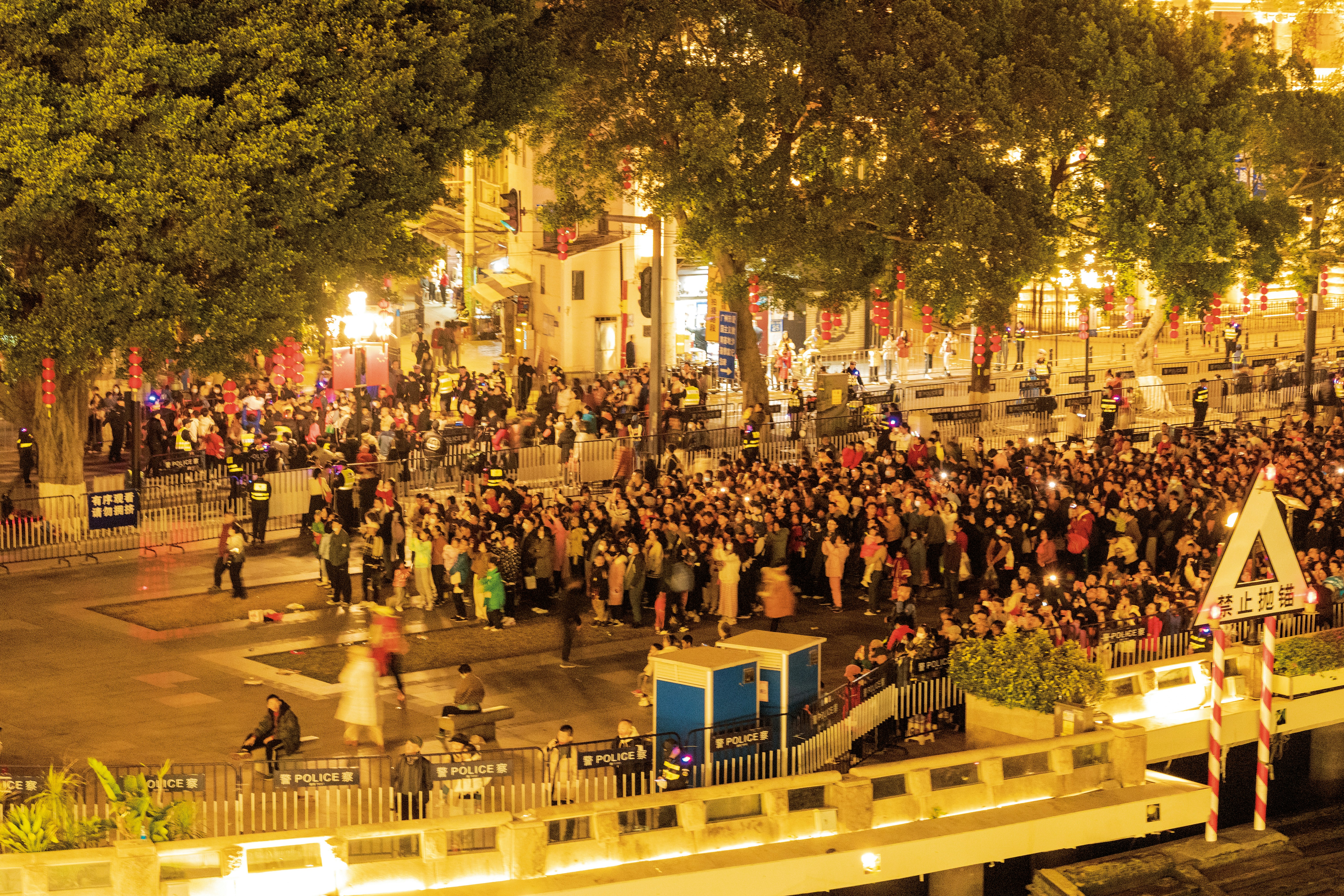 a large group of people standing on a street
