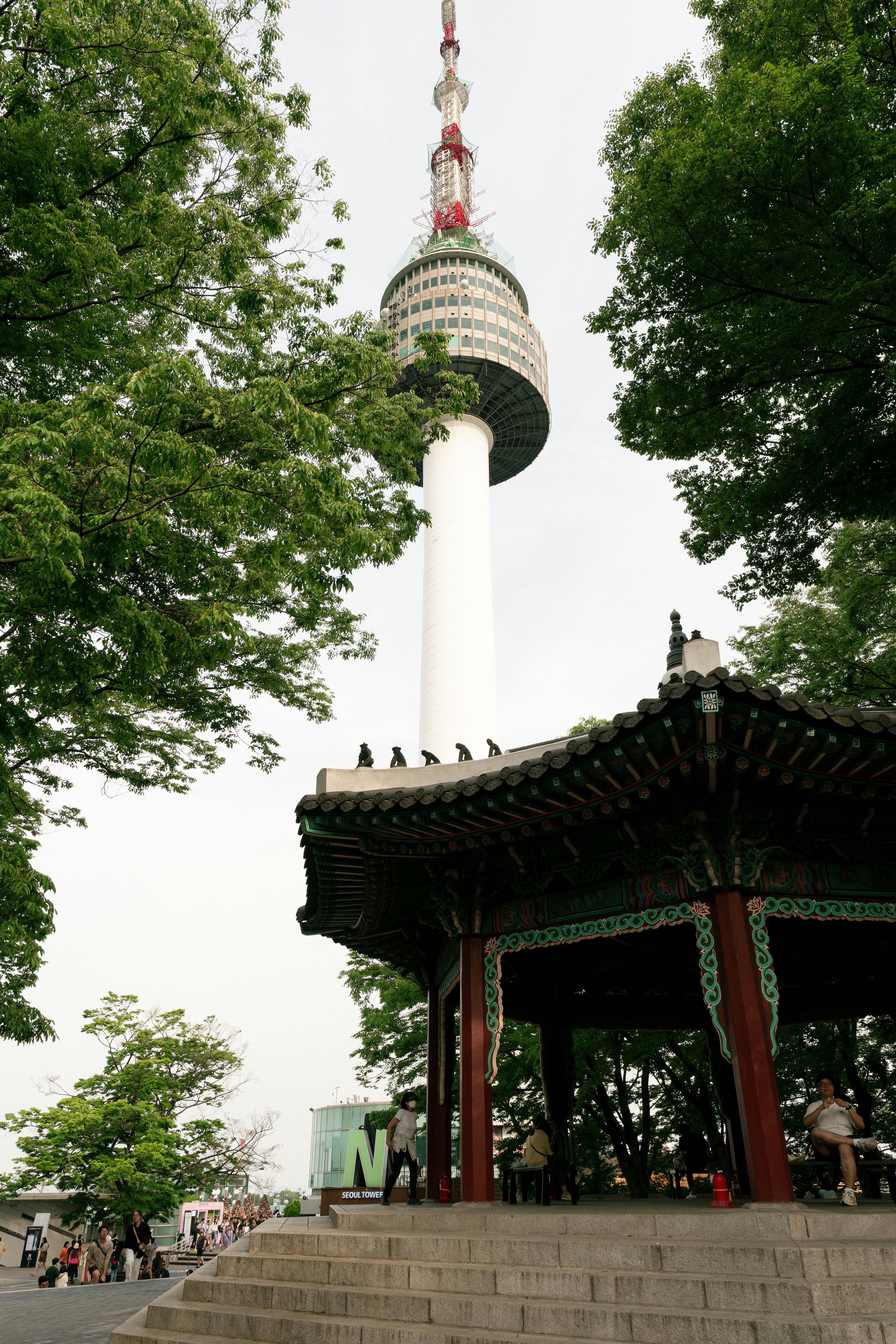 a gazebo with a tower in the background