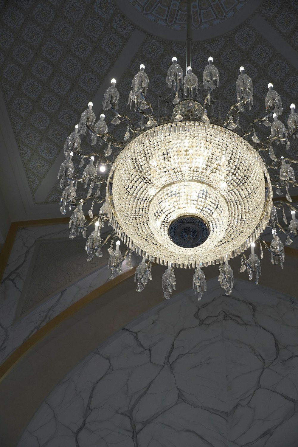 a chandelier hanging from the ceiling in a room