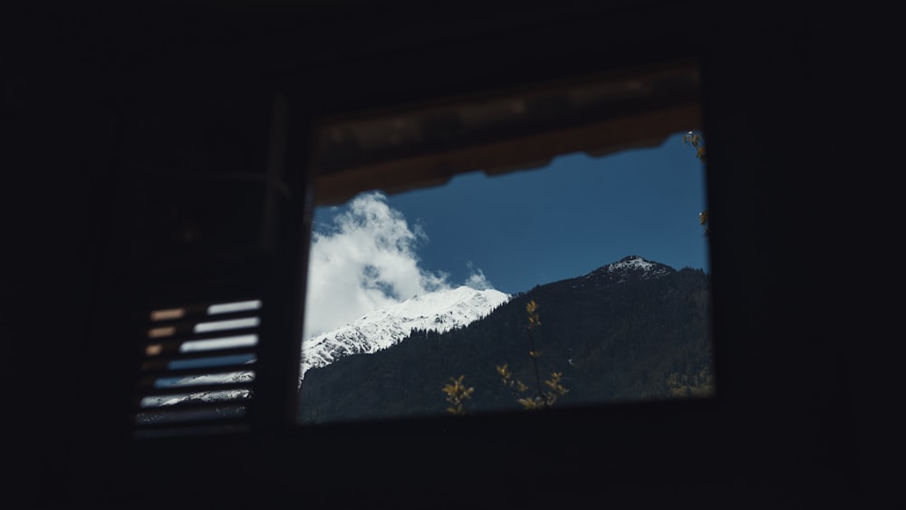 a view of a mountain through a window