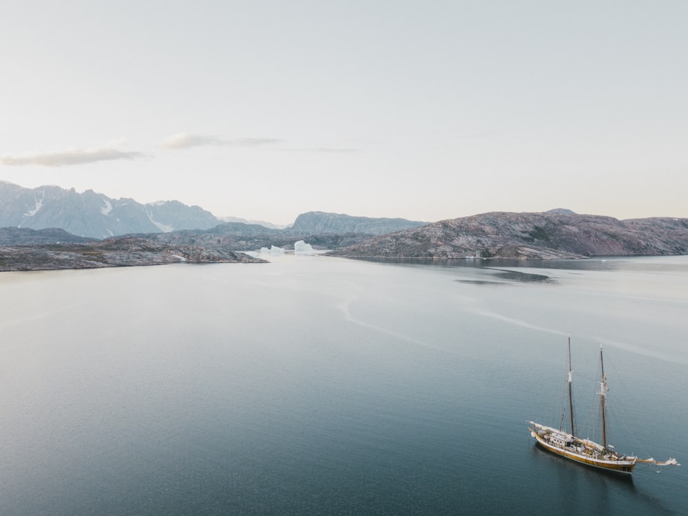 a boat floating on top of a large body of water