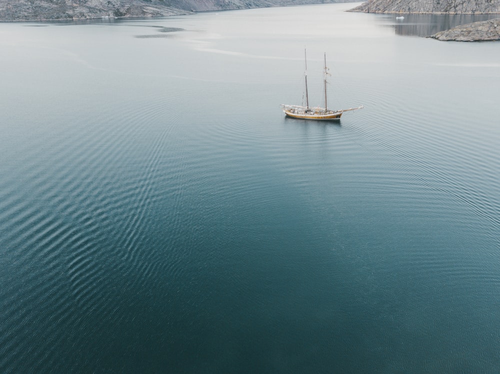 a boat floating on a large body of water